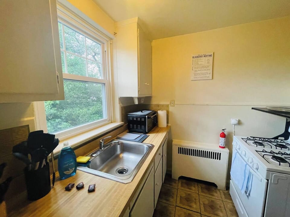 Step into a well-appointed kitchen designed for convenience. It includes a full-sized refrigerator, range, and plenty of counter space for meal prep. You'll find generous storage in the cabinetry, making it easy to keep things organized.
