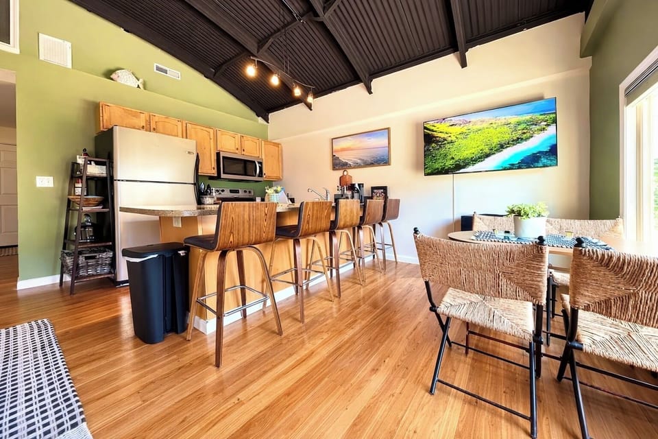 Full Kitchen with Bar Seating
Cook, dine, and gather in this fully stocked kitchen featuring stainless appliances, bar seating for five, and lake-inspired décor.