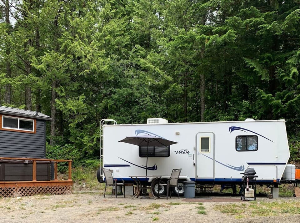 Cozy Cove trailer location next to Tranquil Tiny Home neighbour.