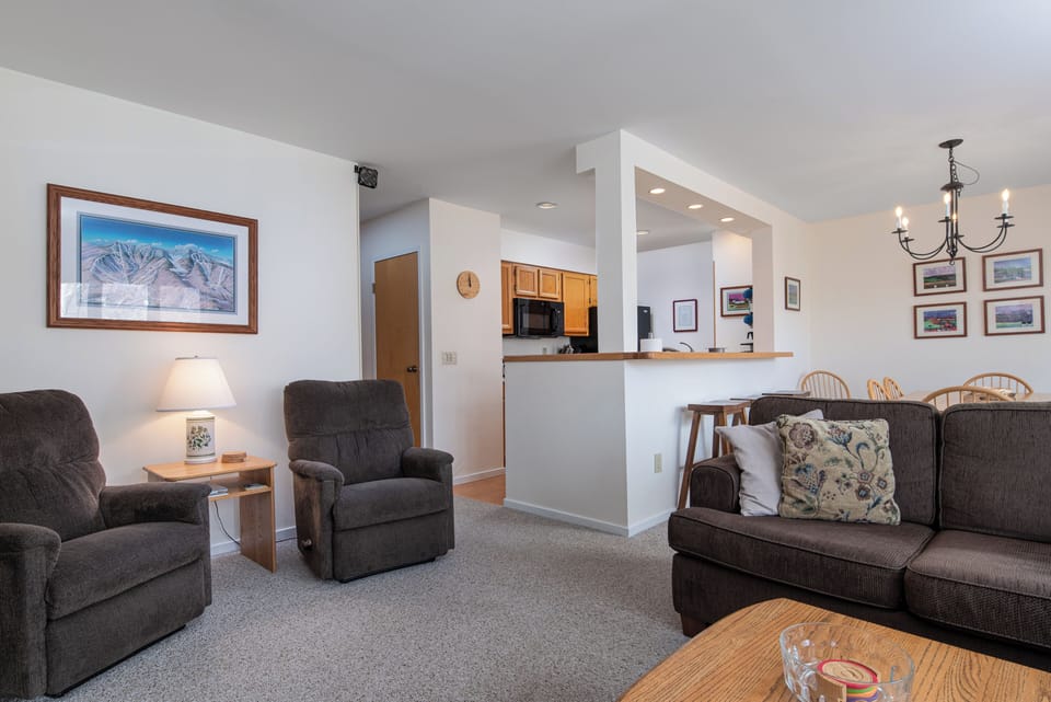 - Living room with plush seating and open layout - Easy flow from kitchen to cozy gathering area - Relax and connect after outdoor adventures nearby