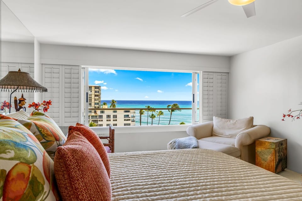 Spacious primary suite with panoramic views of Diamond Head and the coastline, offering a peaceful retreat to begin and end each day.