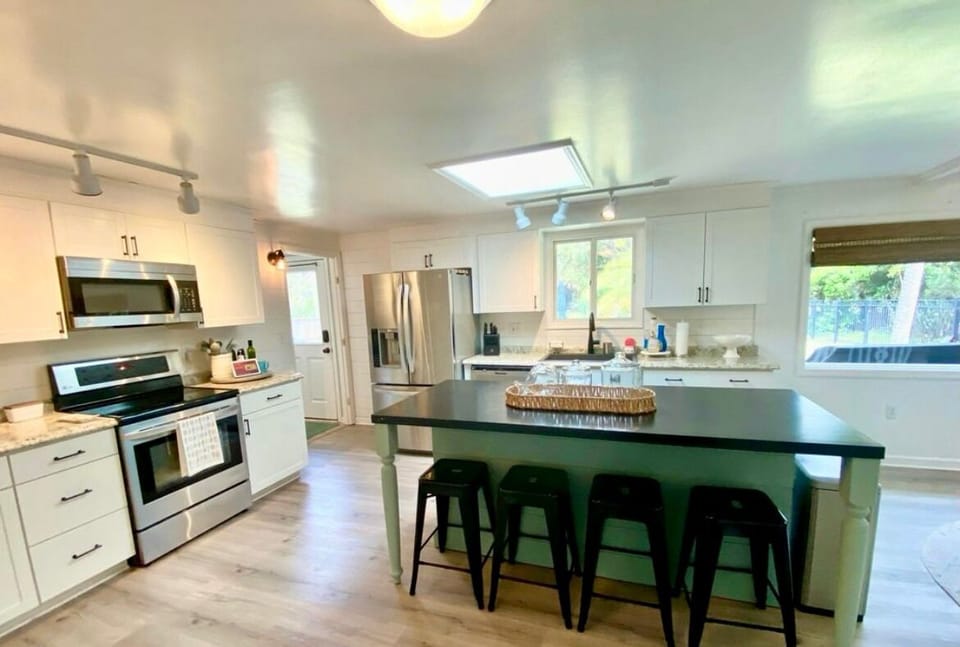 View of backyard from kitchen and living areas