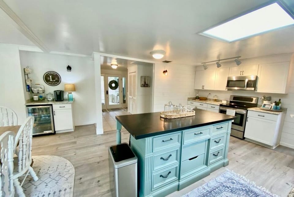Fully stocked kitchen with coffee bar & wine frig 