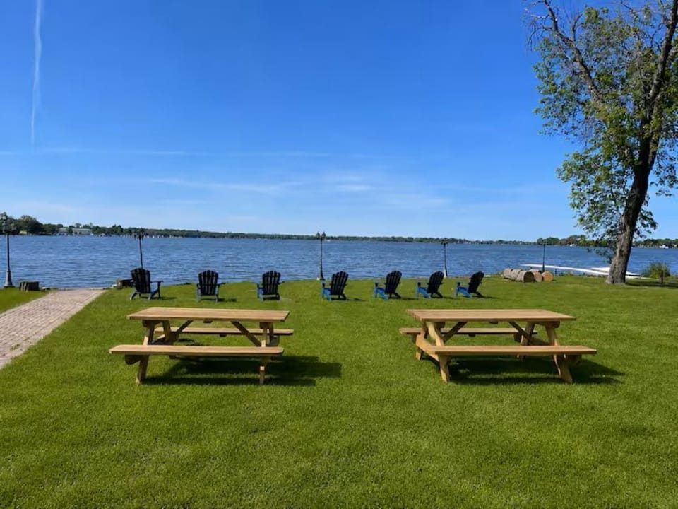 Enjoy breathtaking lake views from the spacious waterfront lawn
