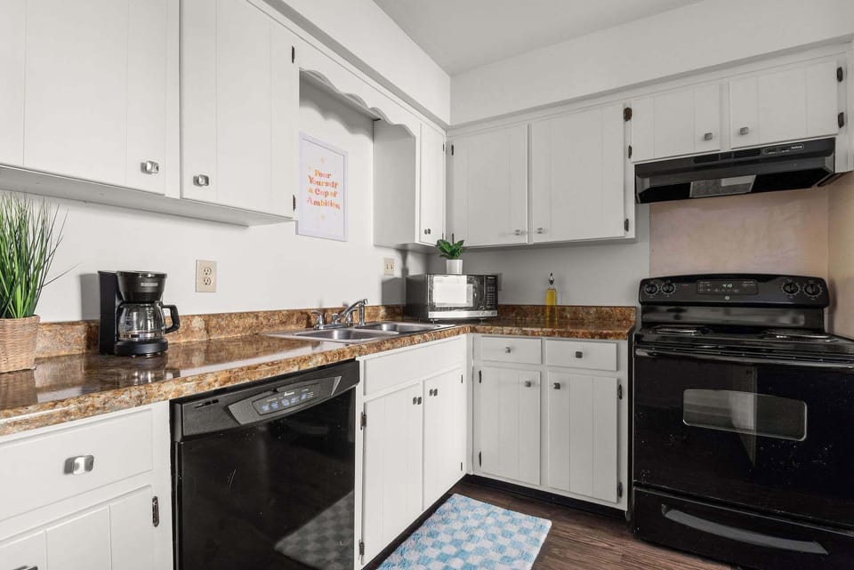 A full kitchen with modern appliances and all the essentials for cooking.