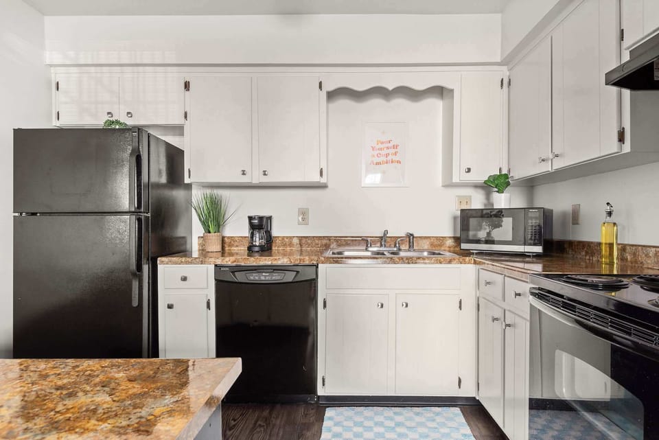 A full kitchen with modern appliances and all the essentials for cooking.