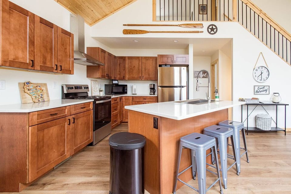 Chef-ready kitchen with island seating for casual meals or conversation.