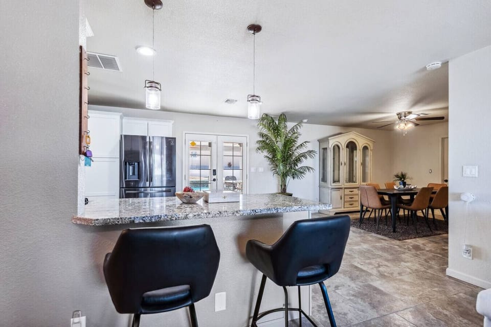 This spacious open-concept home features a well-appointed kitchen with ample counter space and a breakfast bar.