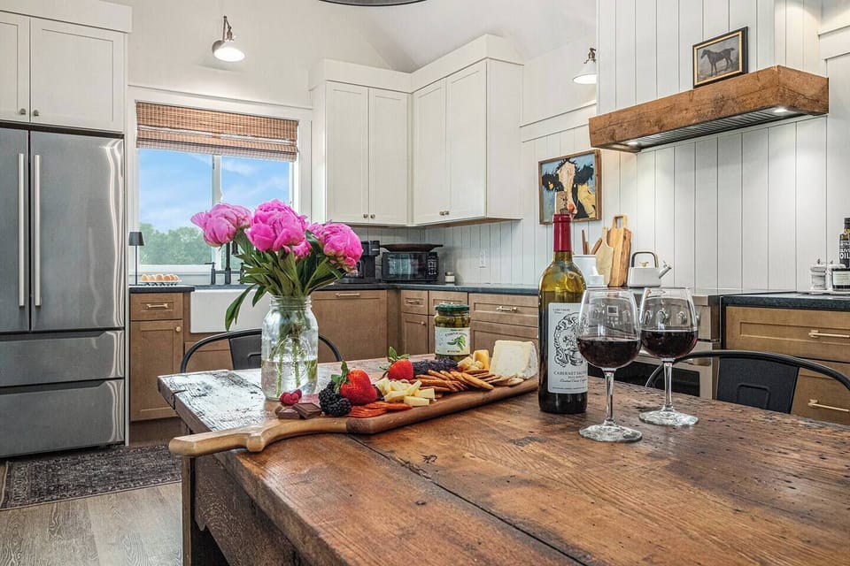 Kitchen: Savor gourmet meals in this stylish kitchen, complete with wine and stunning views!
