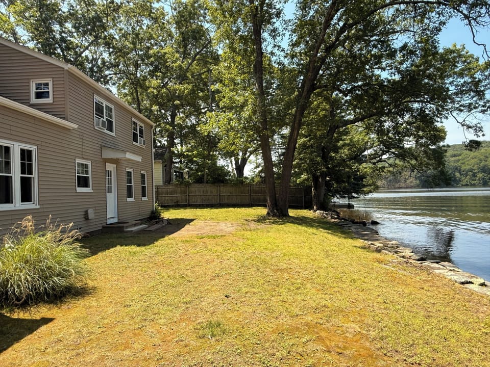 Truly waterfront with a private beach.
