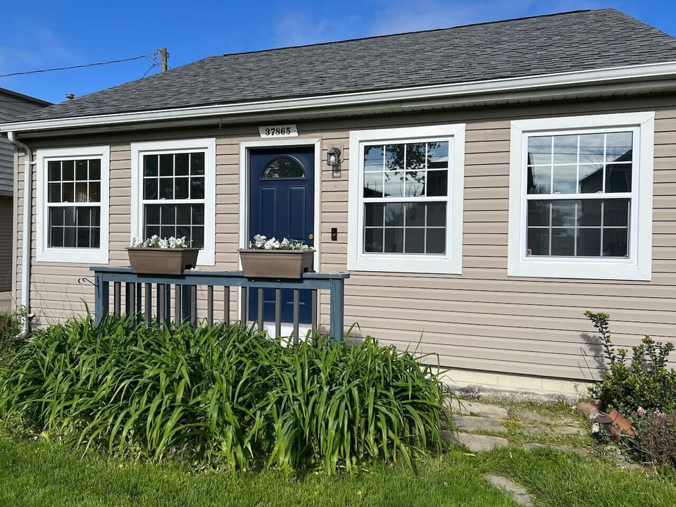 Front yard and your point of entry for check in.  Locks are locked with a passcode, unique for your stay which expire at your checkout time.