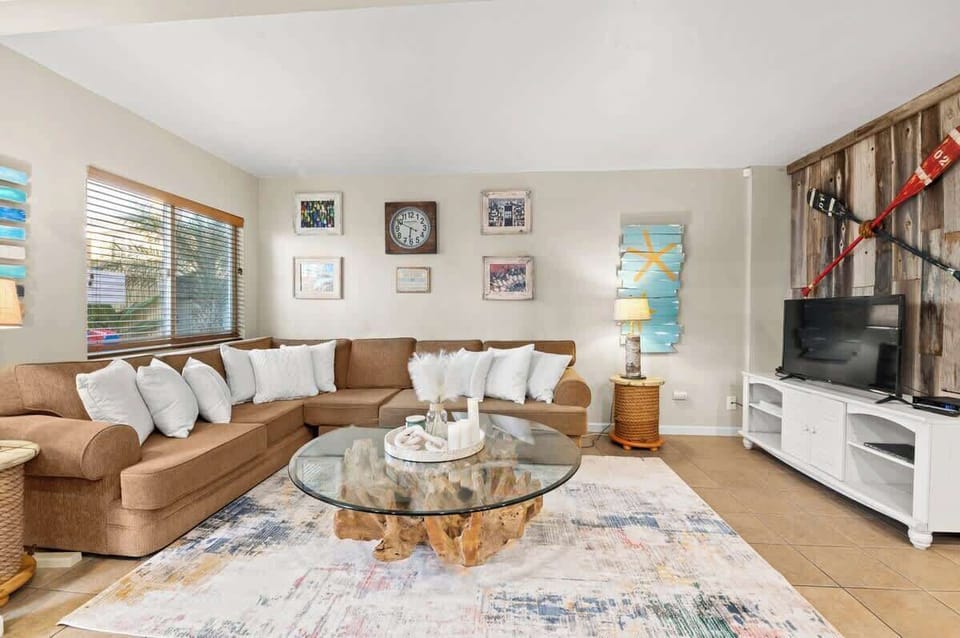 Eloquently decorated living room with a Beach Vibe.  Perfect for gatherings of family and friends 