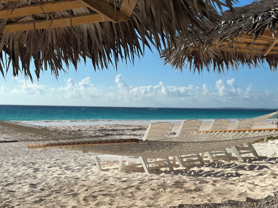 Two thatched beach cabana's, yours and yours alone.
