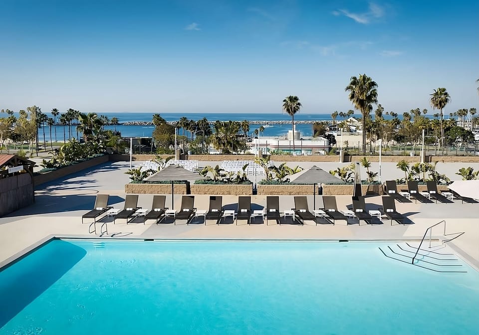 Dive into sunlit pool bliss with sweeping ocean views.