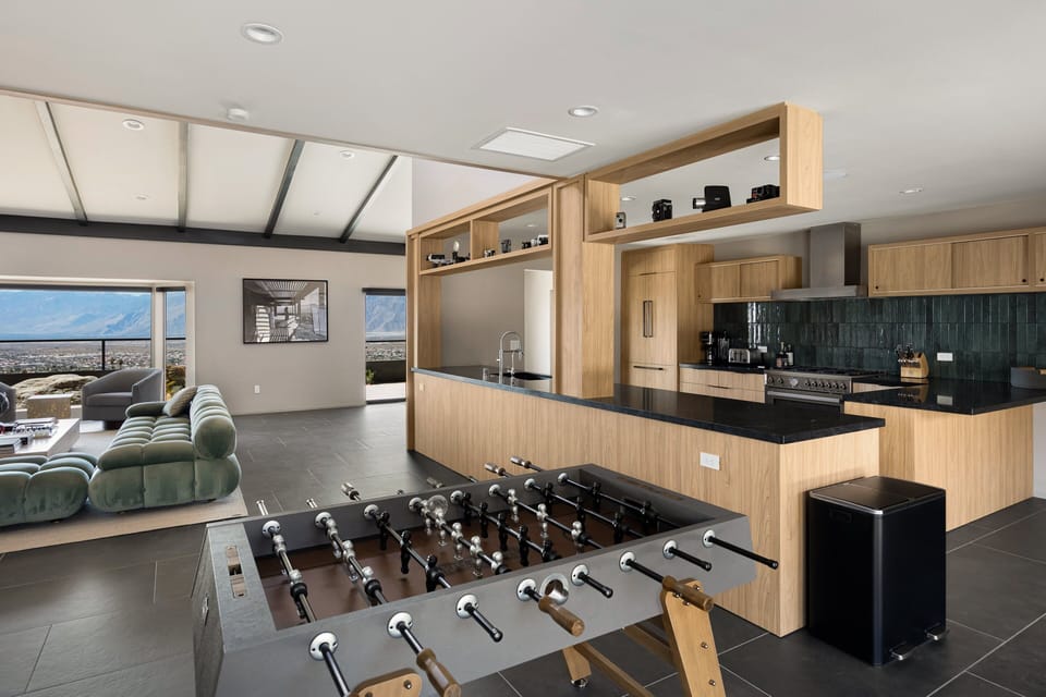 Seamless flow from lounge to entertainment and bar area.
