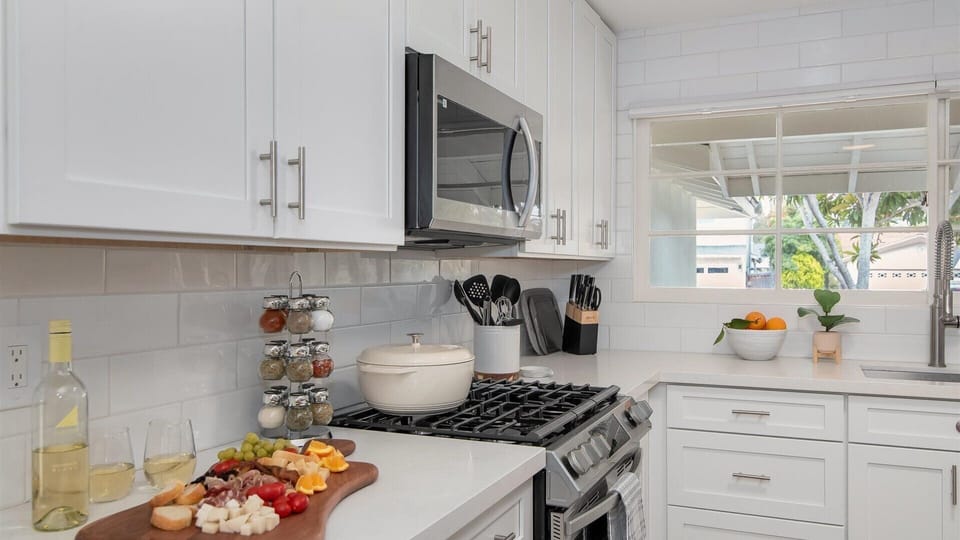 Fully stocked renovated kitchen with loads of cookware and spacious counters.