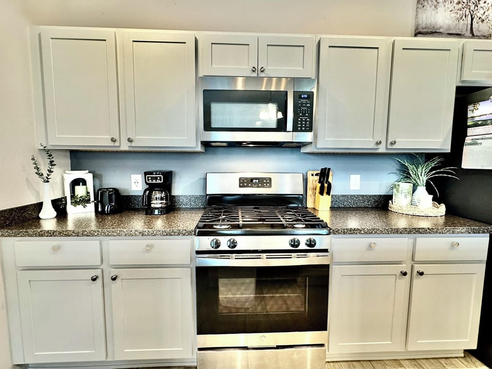 Coffee Pot, Gas Stove and the Refrigerator with Ice and Water Dispenser