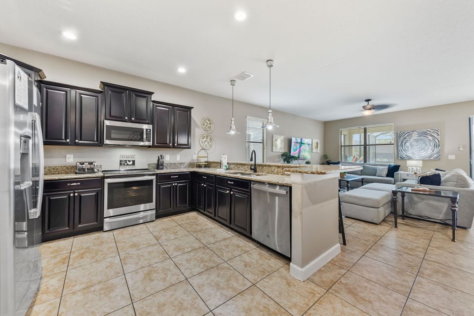 Fully equipped kitchen with stainless steel appliances — perfect for family meals