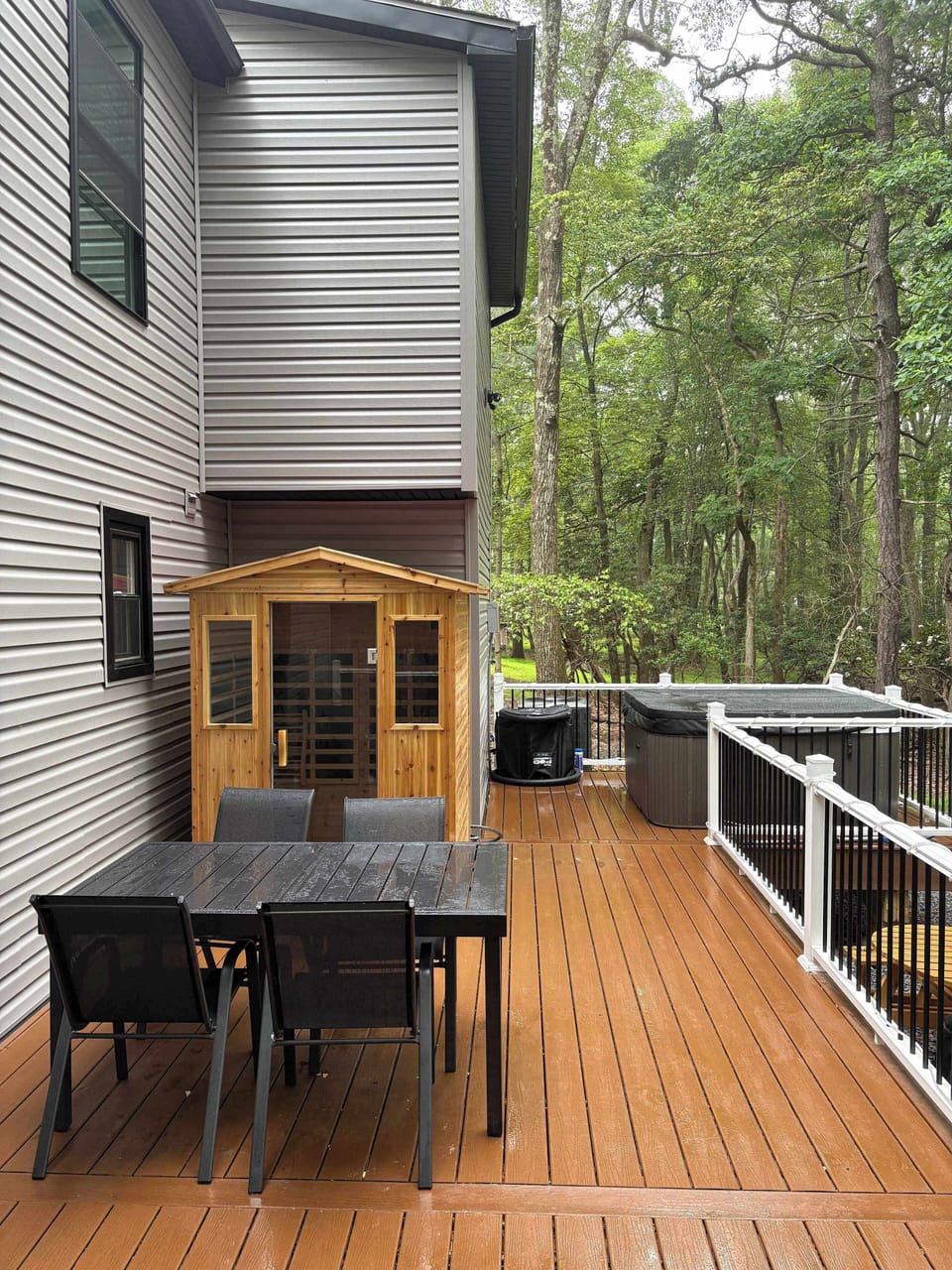 Relax on the deck and take in the peaceful wooded views