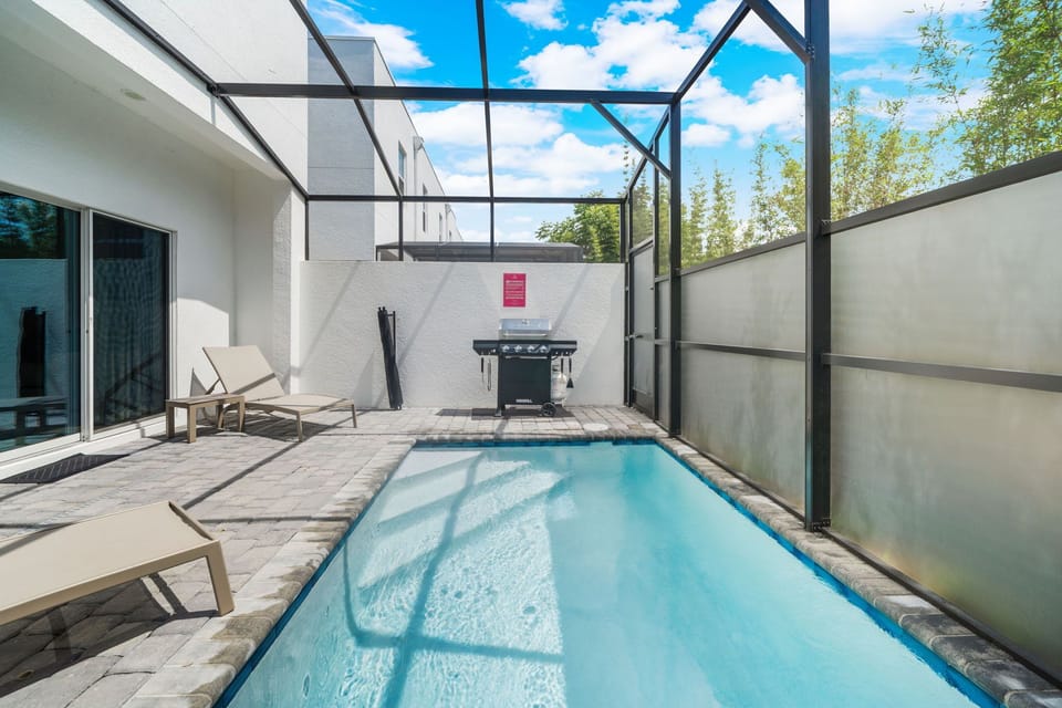 Private pool with BBQ grill and lounge chairs