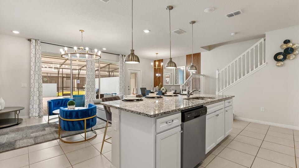 Fully equipped gourmet kitchen with silver appliances 