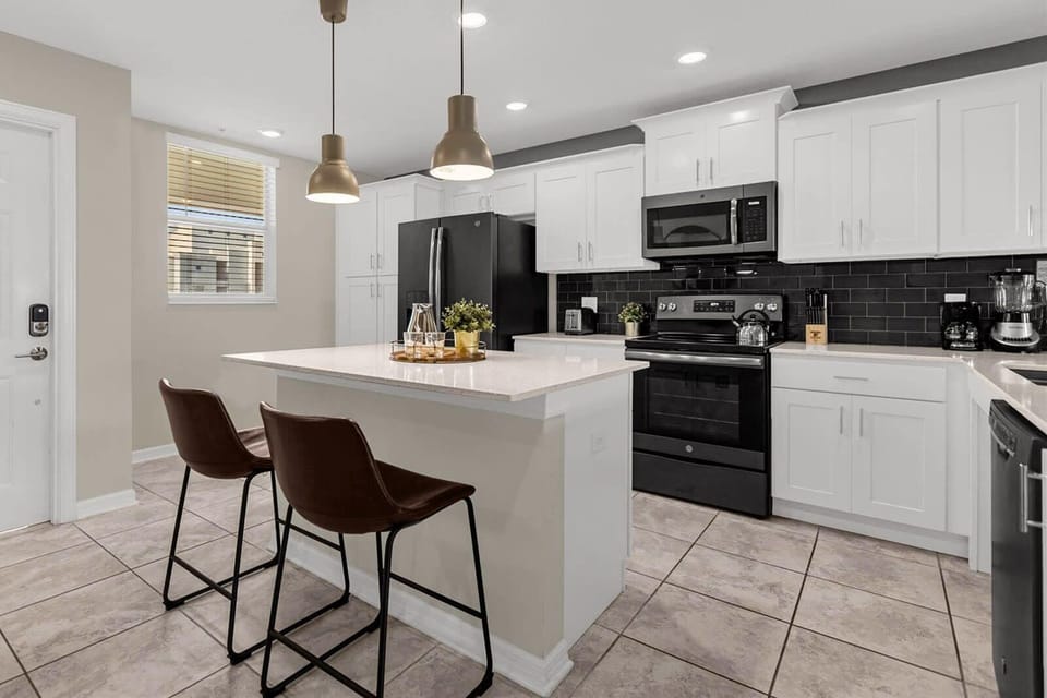 Sleek Kitchen With High-End Appliances And A Spacious Layout