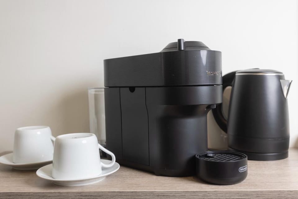 Nespresso Machine & Cups – Coffee essentials ready each morning.

