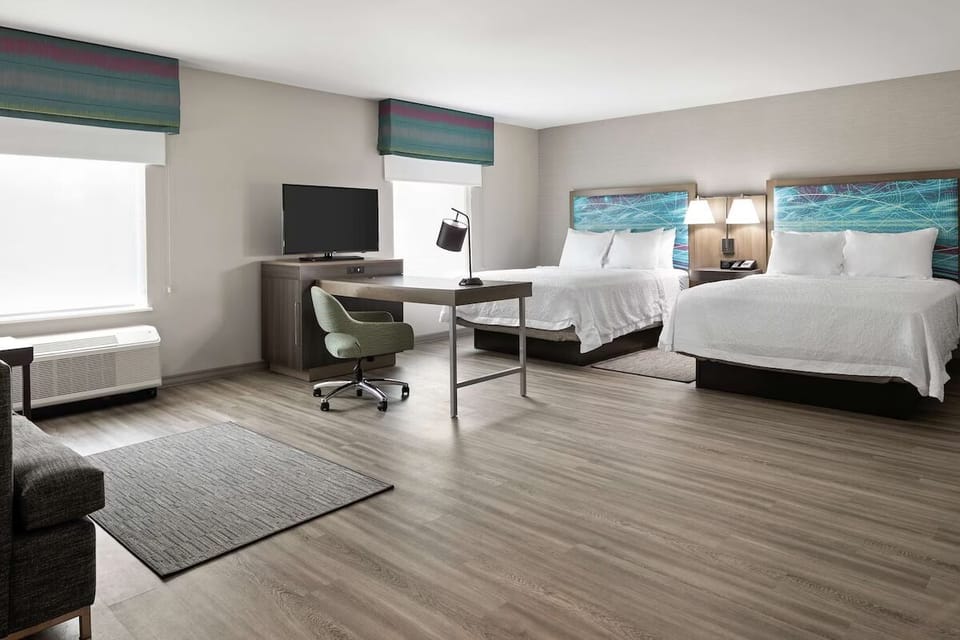 Unwind in a bright, open room with two queen beds.
