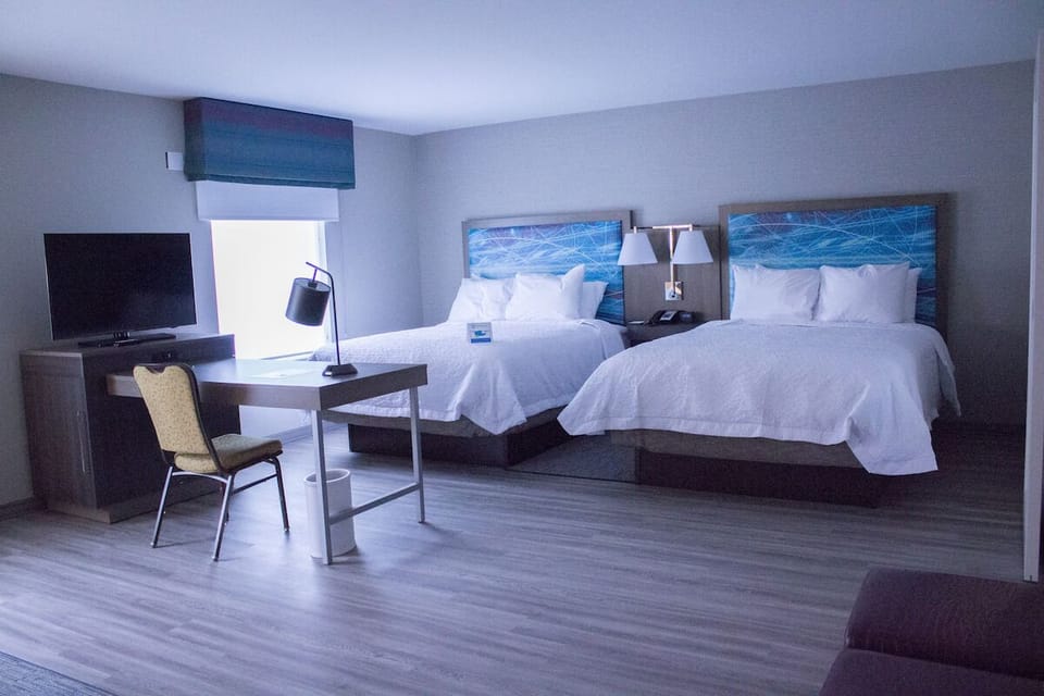 Settle into a spacious double-queen room with work desk.