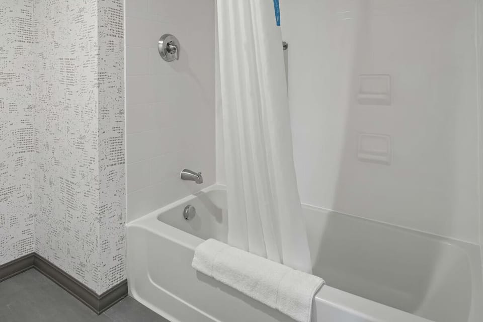 Rinse off comfortably in a spotless shower-tub combo.