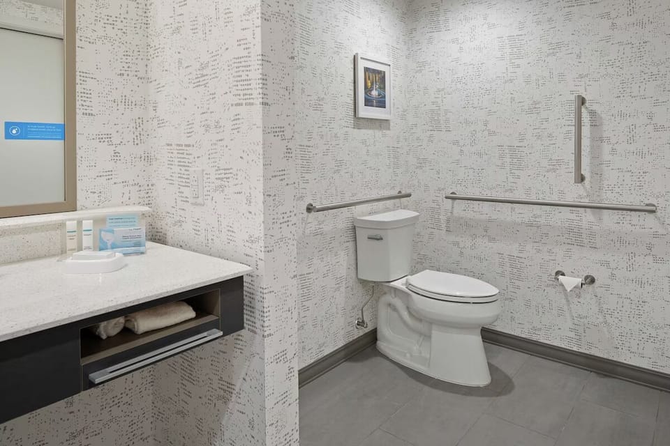 Enjoy an easy, accessible bathroom layout with added support rails.