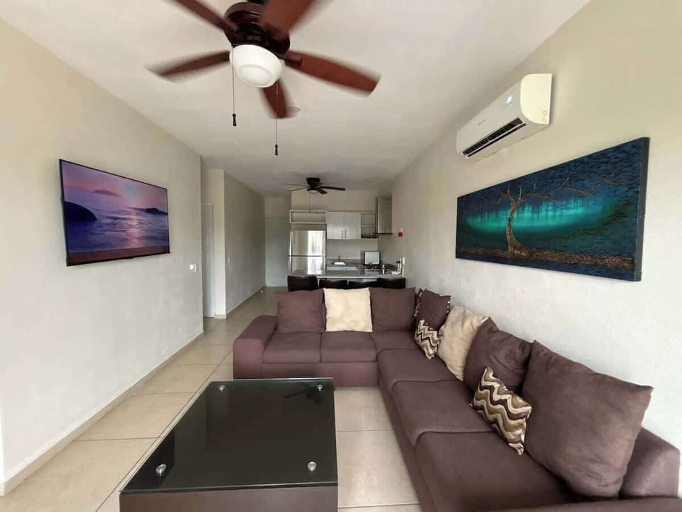 Living room has a plush sofa to enjoy downtime