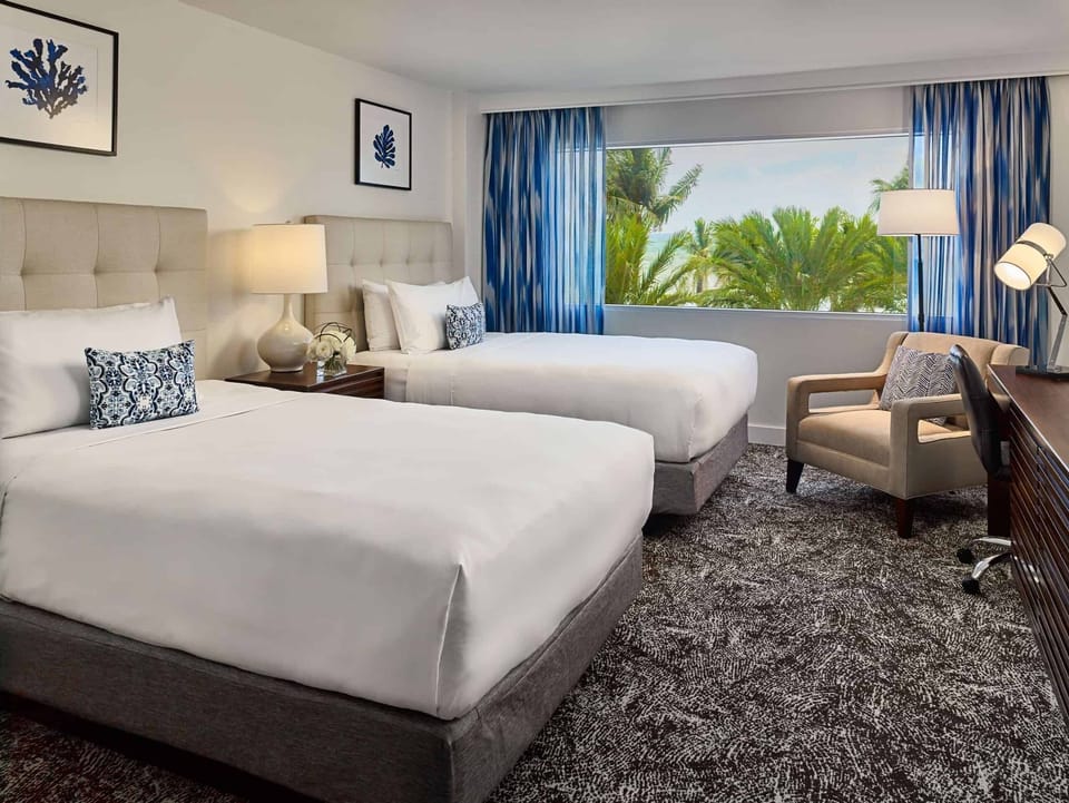 Relax in bright comfort with palms swaying outside your window.
