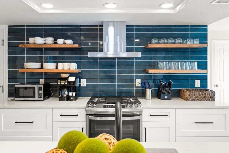 The modern kitchen features sleek design and top-of-the-line appliances.