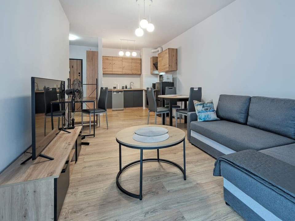 Living Room with Sofa Bed, Smart TV and Working Desk | Book Now with RENTUJEMY.COM