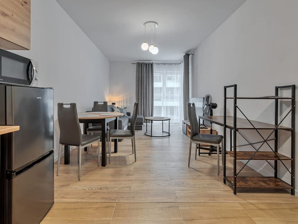 Living Room with Sofa Bed, Smart TV and Working Desk | Book Now with RENTUJEMY.COM