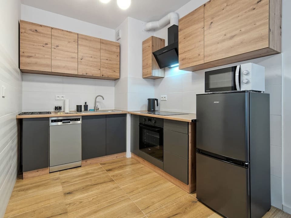 Kitchen with Dishwasher, Microwave and Dining Table | Book Now with RENTUJEMY.COM