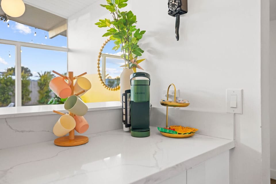 Start your day right with a fully stocked coffee and tea station featuring a Keurig.