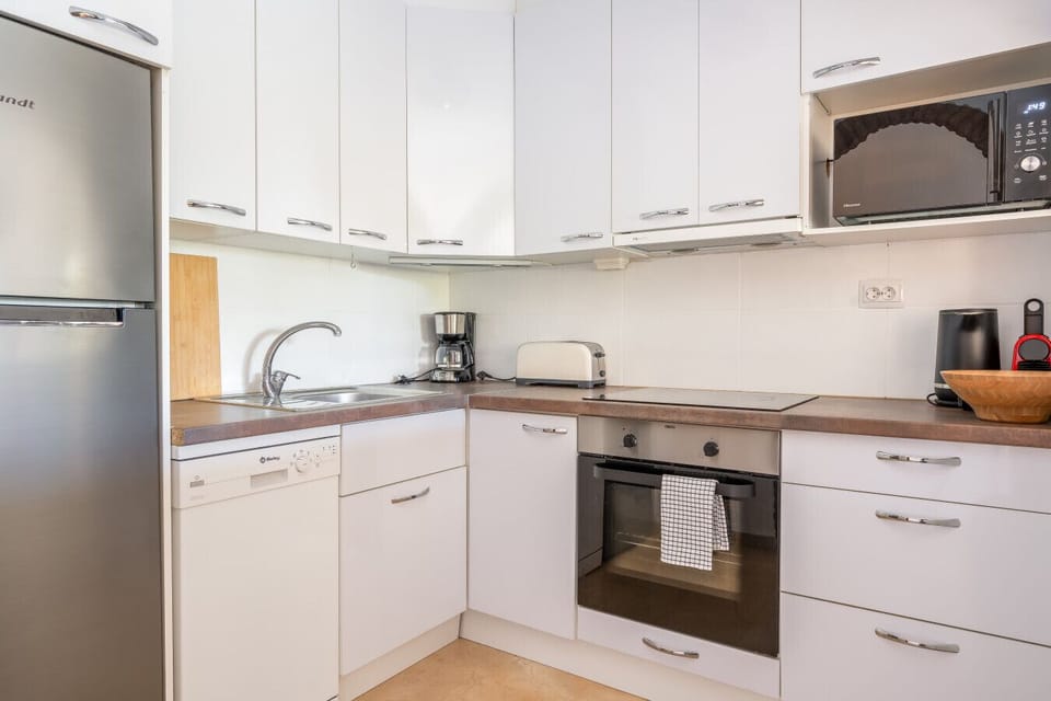 Cook with confidence using modern appliances, including a full-sized oven and dishwasher for a truly stress-free holiday.