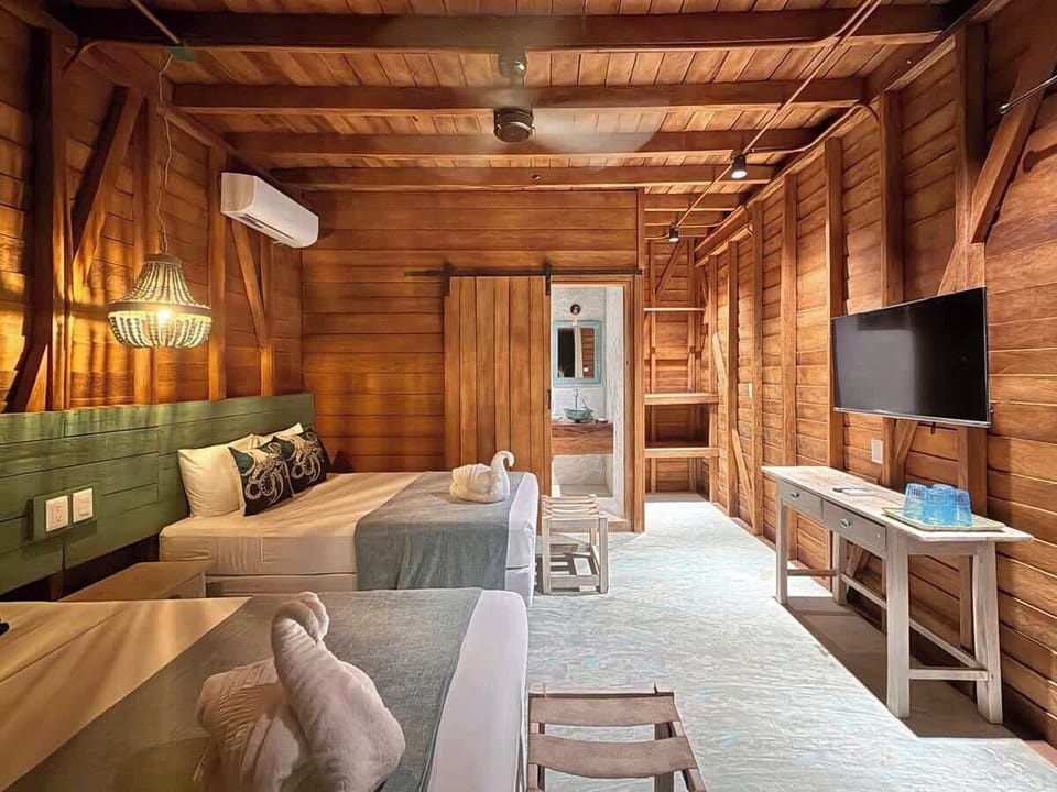 Cozy wood room with two beds