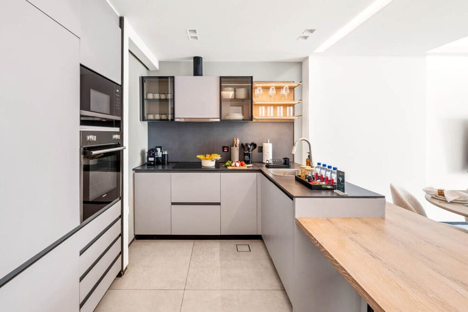 Modern kitchen equipped with essential cooking utensils for your culinary needs.
