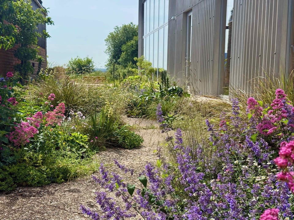The private outdoor cottager garden at South Barn is perfect for al fresco holiday dining and relaxing in the Isle of Wight sun.