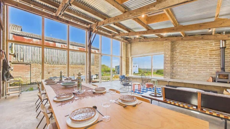 The grand dining table is the social heart of the home, comfortably seating large holiday groups.