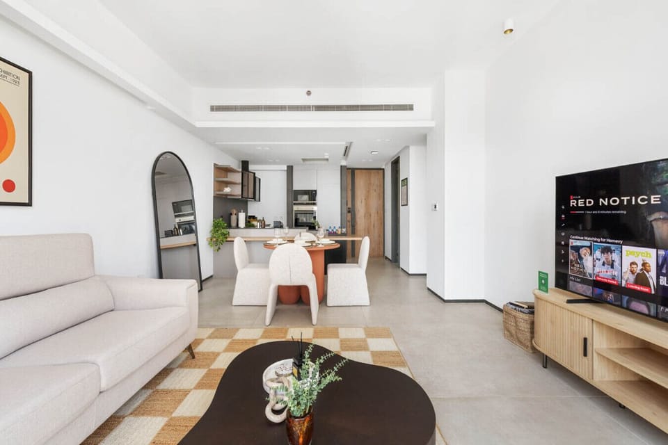 Cozy living room with a modern touch and ample natural light.
