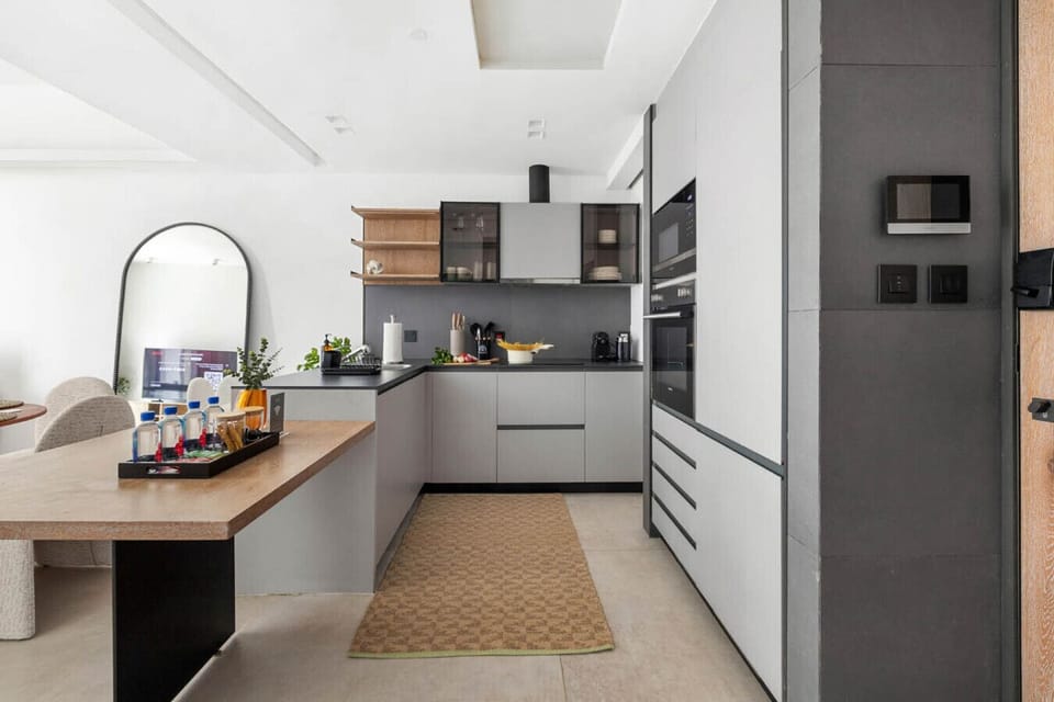 Modern kitchen equipped with essential cooking utensils for your culinary needs.