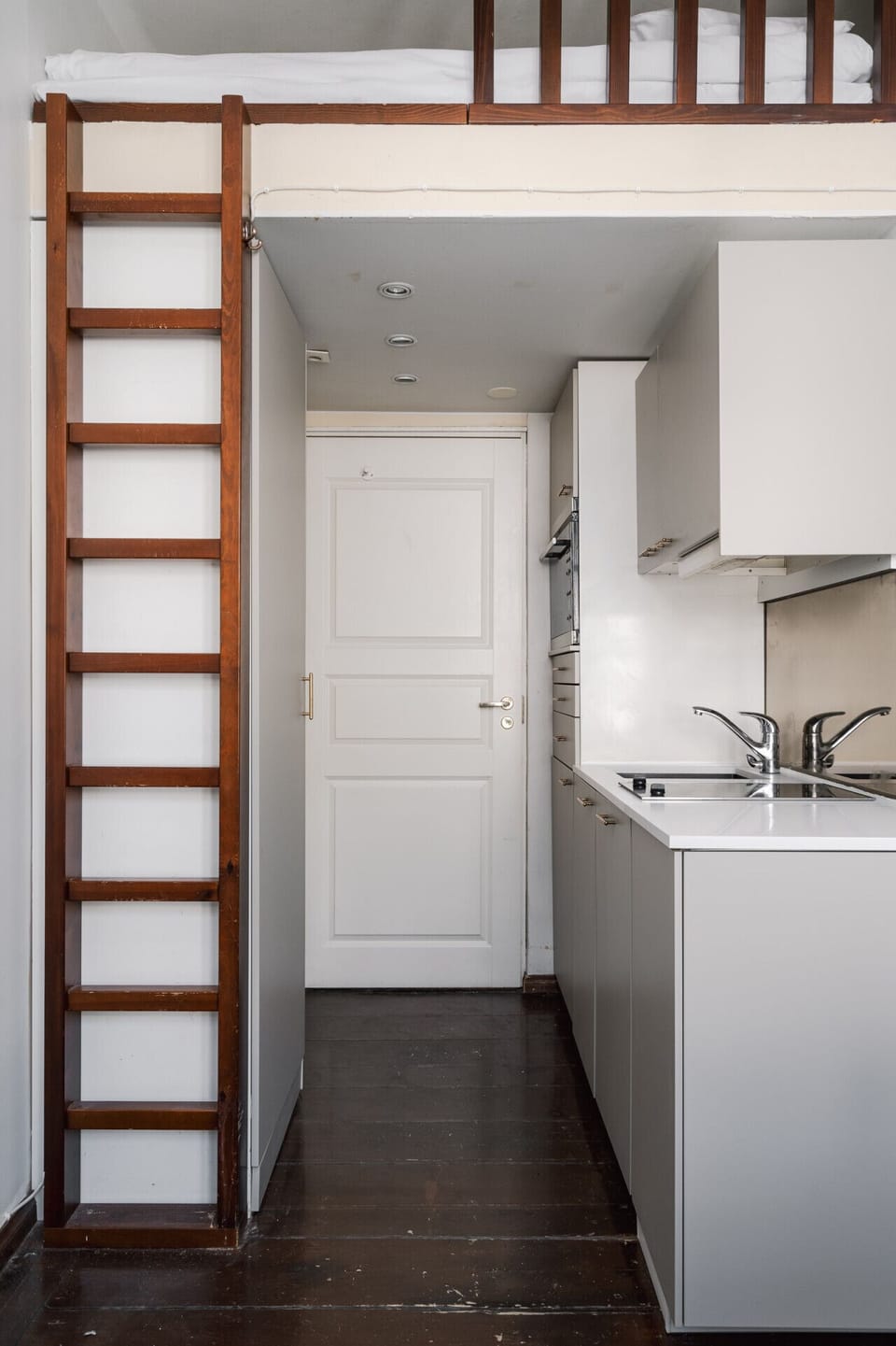 The sleeping loft is a small, enclosed space accessed via a steep ladder. Once inside, the ceiling is low—you’ll need to crawl in and out. It’s a snug, cabin-like experience, perfect for travelers looking for something quirky and different.