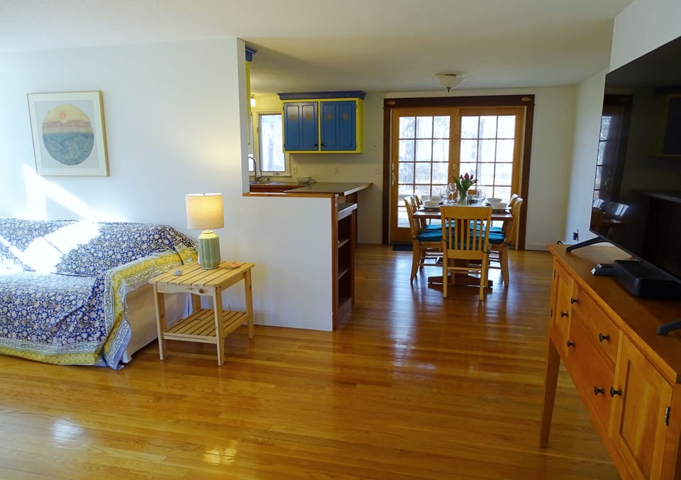 View to dining area (seats 6); deck is through sliding French door. 