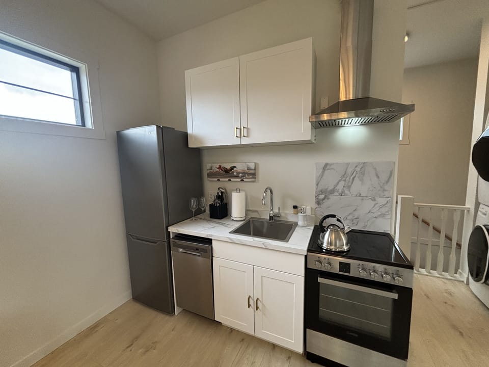 compact kitchen overlooking great room area