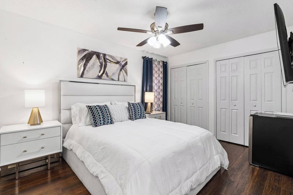 Elegant third room upstairs features a queen-size bed with TV set and mini refri. 