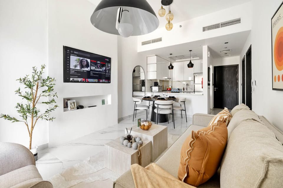 Open-plan layout with living, dining, and kitchen in one bright space